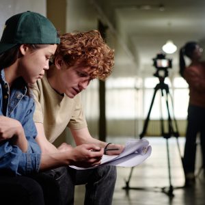 Reviewing Script in Film Production Setting